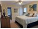 Relaxing bedroom featuring a queen-size bed, adjoining bathroom, and a ceiling fan at 1001 Jungle Shores Dr # 1/4 Share Interval, Edisto Beach, SC 29438