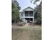 Charming home with a screened porch and lovely landscaping at 1001 Jungle Shores Dr # 1/4 Share Interval, Edisto Beach, SC 29438