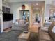 Cozy living room with wood floors, a fireplace, and a large area rug at 1001 Jungle Shores Dr # 1/4 Share Interval, Edisto Beach, SC 29438