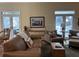 Inviting living space with comfortable seating, wood floors, and access to an outdoor deck at 1001 Jungle Shores Dr # 1/4 Share Interval, Edisto Beach, SC 29438