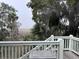 Picturesque view from the deck overlooking a serene marsh landscape framed by trees and moss at 1001 Jungle Shores Dr, Edisto Island, SC 29438