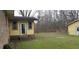 Rear porch and building on a lawn with mature trees at 1097 Murrell Block Dr, Pineville, SC 29468