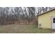 View of a brick wall separating property with a backyard utility building at 1097 Murrell Block Dr, Pineville, SC 29468