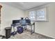 Bright, carpeted bedroom with a window, desk, and an organized workspace at 111 A Heatley St, Moncks Corner, SC 29461