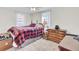 Bedroom with a large bed, wooden dresser, and natural light from the windows at 111 A Heatley St, Moncks Corner, SC 29461