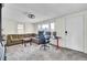 Bright and airy living room with a large sectional sofa and a workspace near the windows at 111 A Heatley St, Moncks Corner, SC 29461