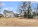 Wide-open backyard with trees, lawn, and patio at 113 Hartley Hall Ct, Summerville, SC 29485