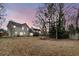 Expansive backyard showcasing ample space, mature trees, and outdoor potential for recreation and landscaping at 113 Hartley Hall Ct, Summerville, SC 29485