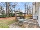 Relaxing backyard space with a covered swing and patio table at 113 Hartley Hall Ct, Summerville, SC 29485