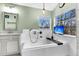 Bright bathroom with a soaking tub, marble countertops, and a wall-mounted showerhead at 113 Hartley Hall Ct, Summerville, SC 29485