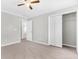 Neutral bedroom with plush carpet, ample closet space, and a ceiling fan at 113 Hartley Hall Ct, Summerville, SC 29485