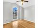 Bright bedroom featuring a large window, hardwood floors, and ample natural light, creating a welcoming space at 113 Hartley Hall Ct, Summerville, SC 29485