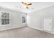 Sun-filled bedroom with carpet and multiple windows offering ample natural light at 113 Hartley Hall Ct, Summerville, SC 29485
