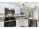 Well-lit kitchen boasting modern appliances and ample counter space at 113 Hartley Hall Ct, Summerville, SC 29485
