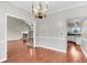 Open floor plan featuring a living room, dining room, and kitchen with hardwood floors at 113 Hartley Hall Ct, Summerville, SC 29485