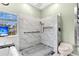 Modern shower with a marble design, a showerhead, and a grab bar for safety at 113 Hartley Hall Ct, Summerville, SC 29485