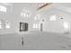Spacious living room with vaulted ceilings, large windows, and sliding glass doors at 1195 Michelle Ln, Johns Island, SC 29455