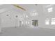 Bright living room with vaulted ceilings, large windows, and sliding glass doors at 1195 Michelle Ln, Johns Island, SC 29455