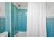 Classic bathroom with turquoise tile accents and a shower-tub combination featuring a white shower curtain at 12 Percy St, Charleston, SC 29403
