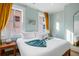 Relaxing bedroom with a comfy bed, bright windows, and a handy mirror for getting ready at 12 Percy St, Charleston, SC 29403
