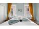 Beautiful bedroom featuring a comfortable bed, two windows, and stylish curtains for a restful retreat at 12 Percy St, Charleston, SC 29403