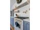 High-end kitchen with a professional grade range, floating shelves, and white marble backsplash at 12 Percy St, Charleston, SC 29403