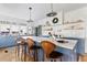 Modern kitchen featuring blue cabinets, a large island with counter seating, and stainless steel appliances at 12 Percy St, Charleston, SC 29403