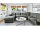 Comfortable living room featuring a large sectional sofa and a view of the outdoors through the window at 12 Percy St, Charleston, SC 29403