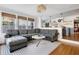 Open-concept living room flows into the kitchen, offering a modern and connected living space at 12 Percy St, Charleston, SC 29403