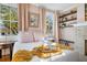 Bright main bedroom with two windows, side tables, and decor for an inviting retreat at 12 Percy St, Charleston, SC 29403