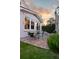 Outdoor brick patio with bistro set, ideal for enjoying a meal under the evening sky at 12 Percy St, Charleston, SC 29403