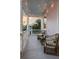 Inviting porch with string lights and comfortable wicker furniture, perfect for relaxing and enjoying neighborhood views at 12 Percy St, Charleston, SC 29403