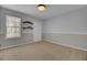 Cozy bedroom with carpet, a window, base molding, and closet at 1205 Scotch Pine Ln, Ladson, SC 29456