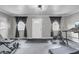 Finished exercise room with black rubber flooring and natural light at 1205 Scotch Pine Ln, Ladson, SC 29456