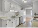 Bright kitchen with stainless steel appliances, white subway tile backsplash, and natural stone countertops at 1205 Scotch Pine Ln, Ladson, SC 29456