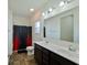 Bathroom with double sink vanity, modern lighting, and shower with a black curtain at 122 Rockingham Way, Moncks Corner, SC 29461