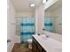 Bathroom featuring a double sink vanity, toilet, and a shower with a blue patterned curtain at 122 Rockingham Way, Moncks Corner, SC 29461