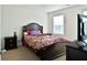 Bedroom with traditional dark wood furniture, window providing natural light, and neutral carpet at 122 Rockingham Way, Moncks Corner, SC 29461
