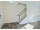 Bright entryway featuring wood-look floors and a staircase with white risers and a wood railing at 122 Rockingham Way, Moncks Corner, SC 29461