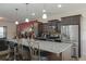 Modern kitchen with granite countertops, stainless steel appliances, and dark wood cabinets at 122 Rockingham Way, Moncks Corner, SC 29461