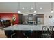 Stylish kitchen with granite countertops, stainless steel appliances, and decorative lighting at 122 Rockingham Way, Moncks Corner, SC 29461