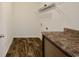 Functional laundry room with ample countertop space and convenient overhead shelving at 122 Rockingham Way, Moncks Corner, SC 29461