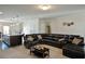 Comfortable living room adjacent to kitchen with ample seating and natural light at 122 Rockingham Way, Moncks Corner, SC 29461
