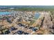 Beautiful aerial view of the community, with a pond, manicured lawns, and inviting neighborhood setting at 130 Darby Mdw Ln, Ridgeville, SC 29472