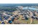 Aerial photograph of the community featuring the house, with a serene pond, landscaped lawns, and neighborhood charm at 130 Darby Mdw Ln, Ridgeville, SC 29472