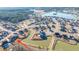 An aerial view of the home within a community, with a pond, landscaped lawns, and an attractive neighborhood setting at 130 Darby Mdw Ln, Ridgeville, SC 29472