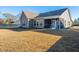 Spacious backyard with covered patio, perfect for outdoor entertaining and relaxation at 130 Darby Mdw Ln, Ridgeville, SC 29472