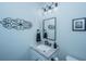 Charming half bath features a granite countertop and elegant decor at 130 Darby Mdw Ln, Ridgeville, SC 29472