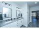 Bright bathroom with double sinks, granite countertop and elegant black fixtures at 130 Darby Mdw Ln, Ridgeville, SC 29472