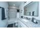Stylish bathroom features a tub/shower combo with marble-look tile and granite countertops at 130 Darby Mdw Ln, Ridgeville, SC 29472
